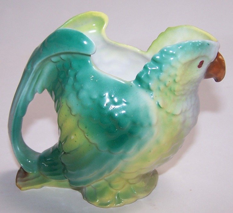 ROYAL BAYREUTH FIGURAL CREAMER: Depicting parrot, approximate height 3 5/8''.