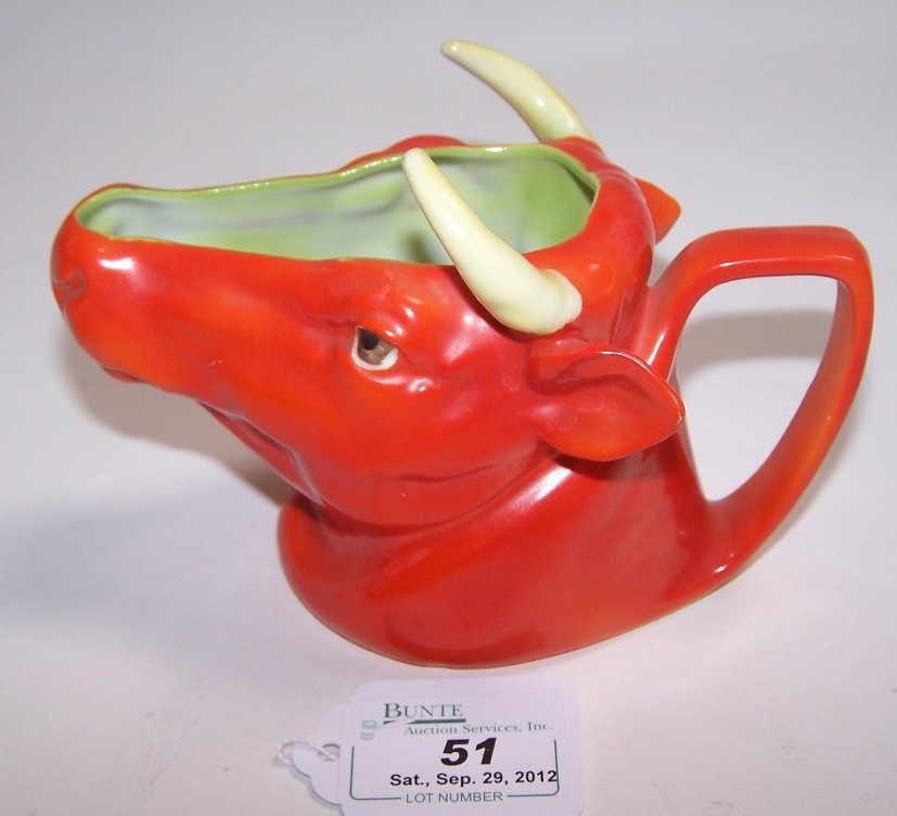 ROYAL BAYREUTH FIGURAL CREAMER: Depicting bull (orange) approximate height 3 3/4''.