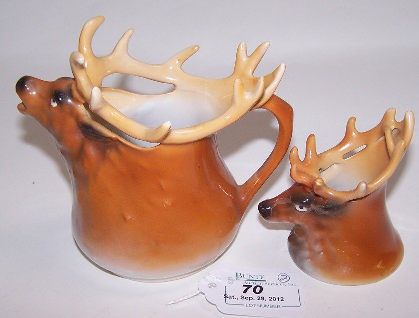 TWO PIECES ROYAL BAYREUTH: Elk, figural creamer and figural toothpick, approximate height of creamer 4 1/2'', height of toothpick 3''.