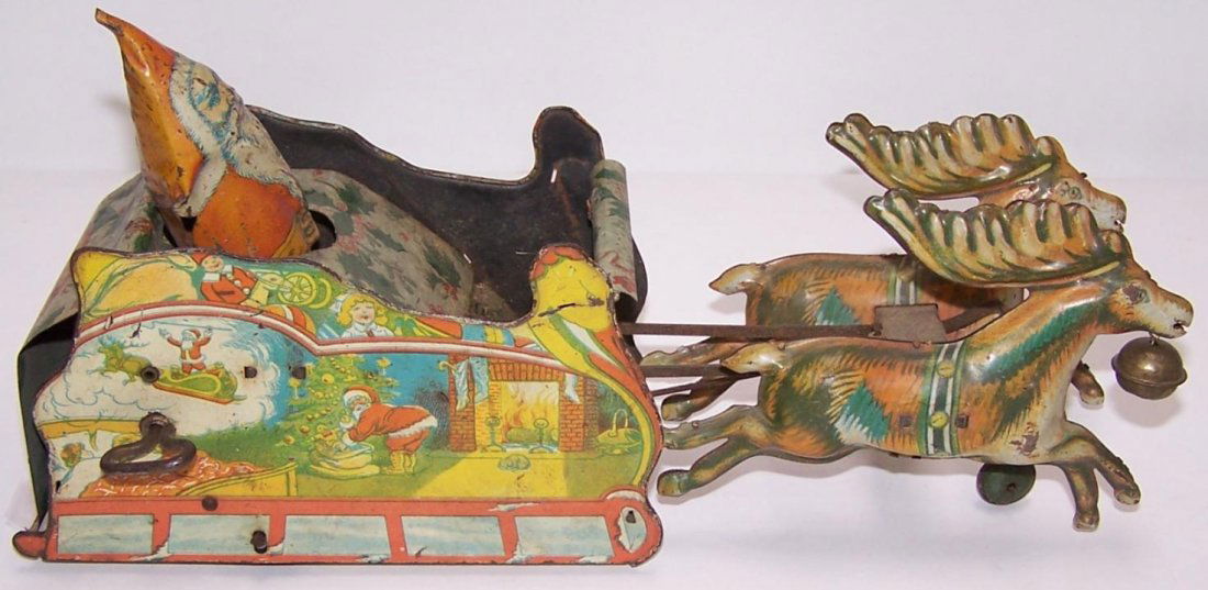 ***TIN WIND UP TOY: Depicting Santa and sleigh, marked on back ''Strauss Mechanical Toys'',