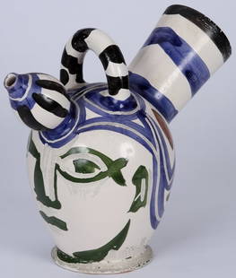 ***PICASSO, PABLO: (1881-1973 Spanish) Ceramic pitcher with two spouts and a handle, ''Pichet Glace'', having white ground and colors of blue, green, black and brown, signed on bottom in black ''Madoura Edition, Picasso