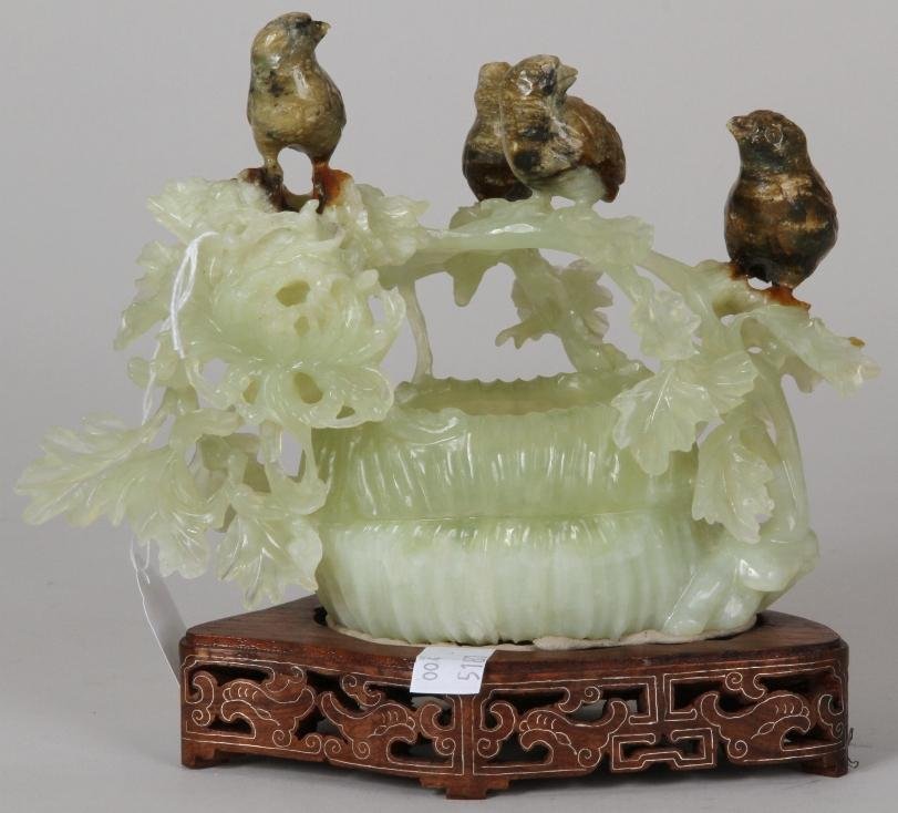 ***CHINESE GREEN HARDSTONE SCULPTURE: Depicting four birds on foliage over nest, raised on a hardwood base, approximate sculpture height 5 3/4''.