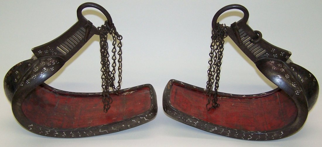 ***PAIR OF JAPANESE BRONZE STIRRUPS: With silver decoration, both are signed, approximate height 10'', approximate length 11 1/2''.