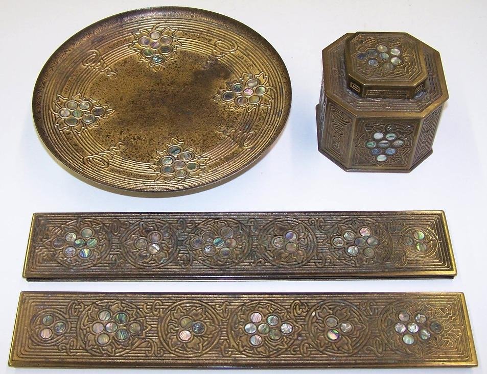 ***FOUR PIECES OF TIFFANY STUDIOS NEW YORK BRONZE: ''Abalone'' pattern, comprising a compote numbered 1733, a covered inkwell numbered 1157 and a pair of blotter ends numbered 1153.