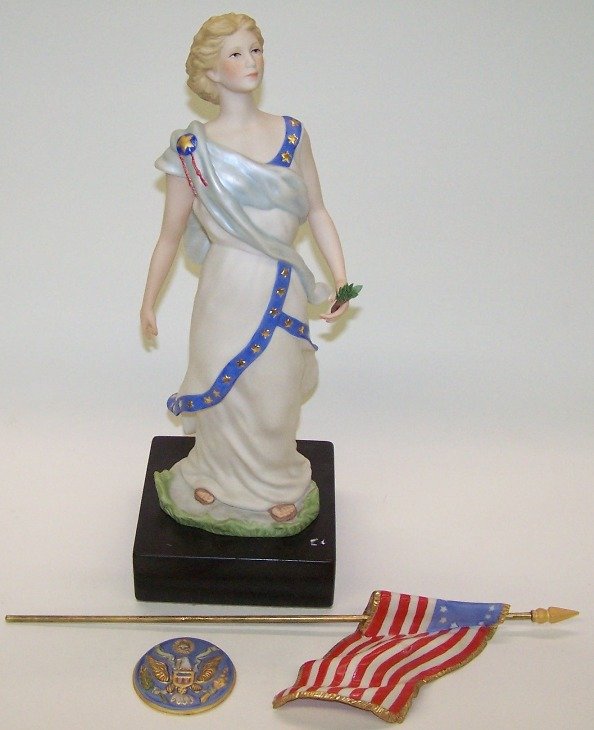 ***CYBIS PORCELAIN FIGURE: Lady Liberty with flag, approximate height 15 1/2''.