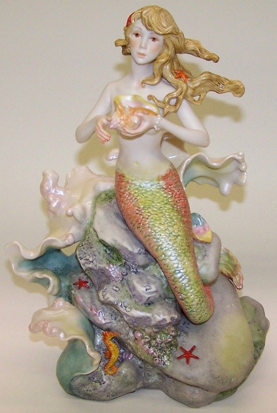 ***CYBIS PORCELAIN FIGURE: ''Mermaid sitting on rock'' #169, approximate height 13 1/2''.