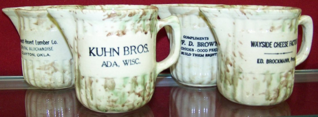 ***FOUR SPATTERWARE ADVERTISING CREAMERS: ''Burnett-Hauert Lumber Co. General Merchandise Clayton Okla.'', ''Kuhn Bros. Ada, Wisc.'', ''Compliments Jeff D. Brown Good Chicks Good Feeds We Build Them Right'' and ''Wayside Cheese Factory Ed Bro