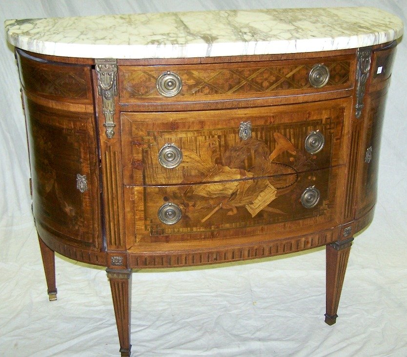 ***LOUIS XVI STYLE COMMODE: Having demilune marble top raised on conforming base, fitted with three drawers flanked by curved doors and raised on square tapering legs, approximate height 35 1/4'', width 43 1/2'', depth 18''.