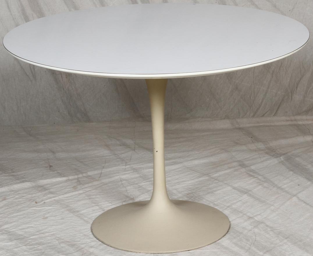 ***FIVE PIECE KNOLL DINETTE SET: Having Eero Saarinen tulip table with pedestal base with knoll sticker, approximate height 28 3/4'', diameter 42'', together with four cream upholstered swivel armchairs raised on pedestal bases, also