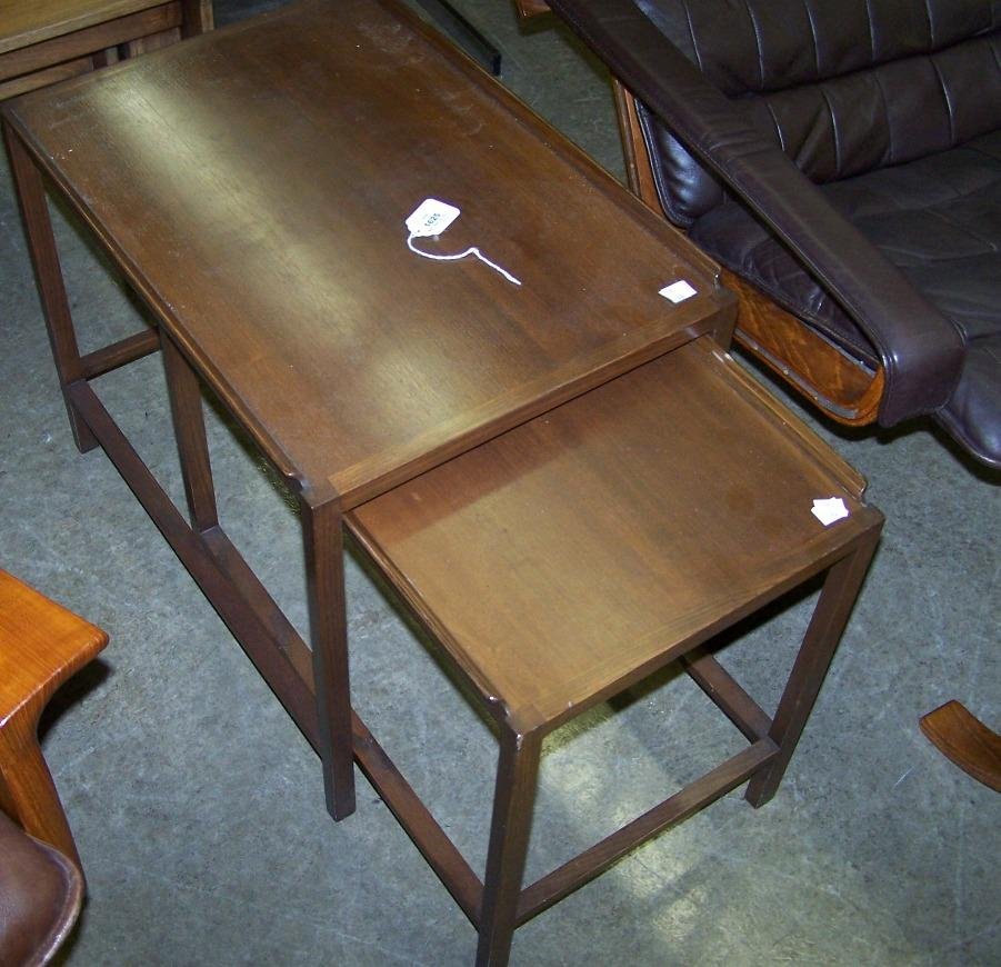 ***TWO MID-CENTURY MODERN NESTING TABLES BY DUNBA: Approximate height 19'', width 15 1/2'', depth 22 1/4''.