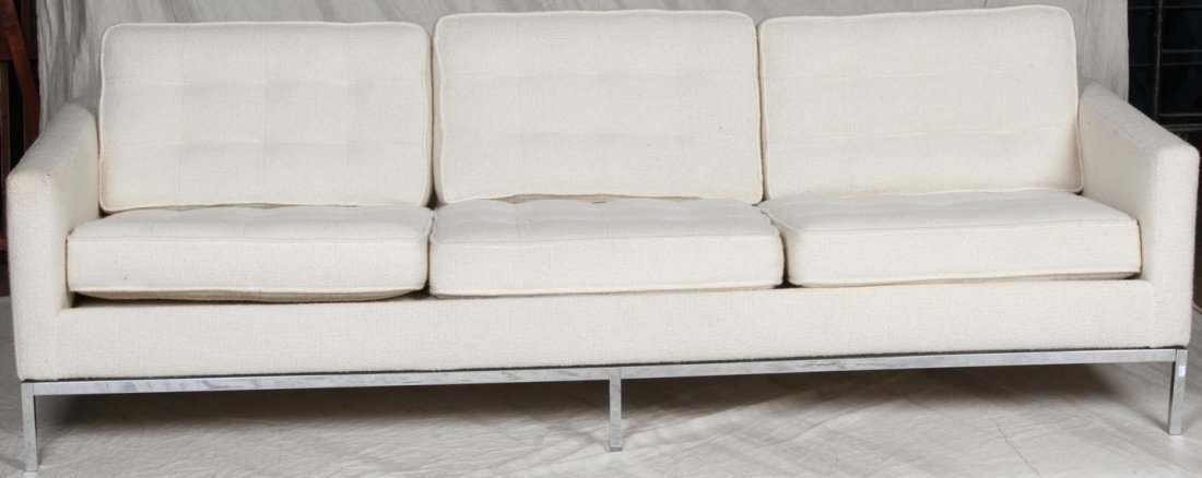 ***TWO PIECE KNOLL SOFA AND LOVESEAT SET: Tuxedo style, having cream tufted upholstery and polished metal frames, approximate width 61'' and 90''.