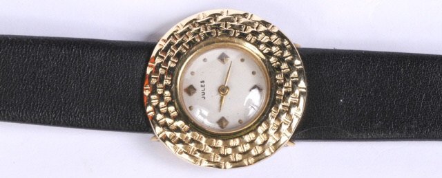 *LADY'S JULES 14K YELLOW GOLD WRISTWATCH: Having jeweled movement, stem wound and set with dot markers on a white finish dial, signed "Jules", contained in a 14K yellow gold case and fitted with black leather straps.