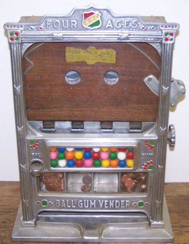 *R.M.C. (ROCKOLLA MFG. CO.) 4 ACES BALL GUM VENDOR: Nickel plated, approximate height 17", with keys.
