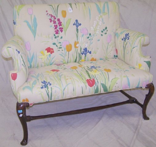 *19TH C. QUEEN ANNE STYLE SETTEE: Having mahogany frame and floral upholstery.