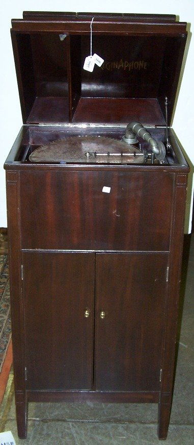 *REGINAPHONE FLOOR MODEL DISC MUSIC BOX: With phonograph tone arm, enclosed in mahogany case having 2 doors opening to storage area.