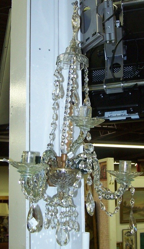 BACCARAT CRYSTAL WALL SCONCE: Fitted with 3 branches and decorated with prisms and pendants.