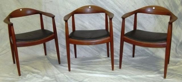 SET OF 3 HANS WEGNER TEAK ARMCHAIRS: Having black vinyl seats, all three marked on underside of frame "Johannes Hansen Copenhagen Denmark".