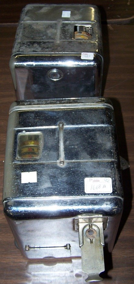 *2 TABLE TOP SLOT MACHINES: Having chrome finish, coin slide on one sidewith reel window on top