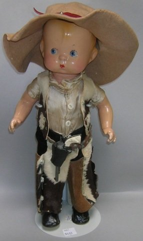 *EFFANBEE COMPOSITION SKIPPY DOLL: Having blonde molded hair, painted blue eyes, dressed in Western outfit, marked on back "Effanbee Skippy," approximate height 14".