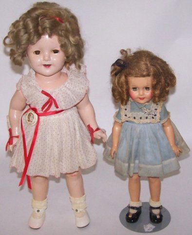 *2 SHIRLEY TEMPLE DOLLS: Composition having sleep eyes with open mouth and teeth, marked on back "Shirley Temple Ideal 18," approximate height 18" and a vinyl Shirley Temple having sleep eyes with open mouth and teeth, marked