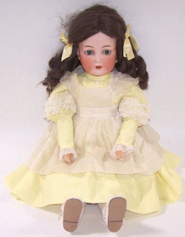*CUNO & OTTO DRESSEL BISQUE HEAD DOLL: Having sleep eyes, open mouth with teeth on composition ball jointed body, marked on back "5 1/2 Cuno & Otto Dressel Germany," approximate height 22".
