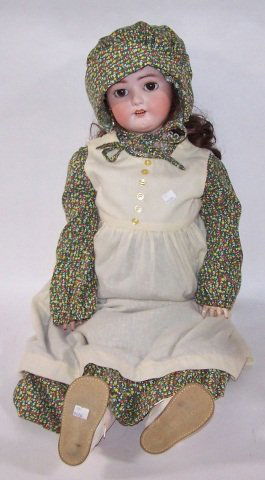 *SIMON & HALBIG BISQUE HEAD DOLL: Having sleep eyes with open mouth and teeth, pierced ears, on composition ball jointed body, marked on back Simon & Halbig 16, Approximately height 36", includes wooden chair and bag of clothing.