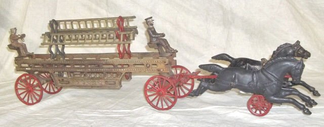 *HUBLEY CAST IRON 2-HORSE DRAWN LADDER TRUCK: 2 black galloping horses with 2 "under horse" spoked wheels pulling ladder wagon having red painted spoke wheels, 2 ladder racks holding 3 ladders, tiller seat is stamped 464, front wheels surround be