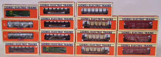 *15 LIONEL "O" GAUGE TRAIN CARS: Two #6-9470 box cars, #6-19413 flat car, three #6-16386 flat cars, two #6315 tank cars, four #6-16373 flat car and three #6-16412 covered hoppers, all in original boxes