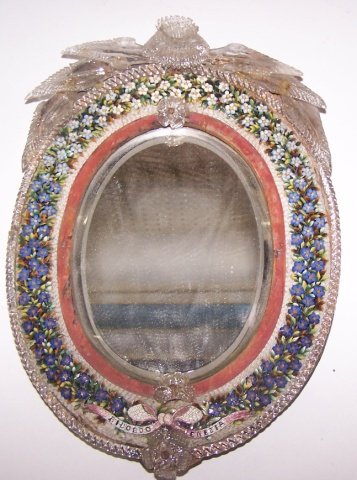 *DRESSER MIRROR: Surmounted with molded glass leaves and enclosed in mosaic frame (one leaf restored), approximate height 12 1/2".