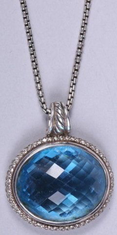*DAVID YURMAN STERLING SILVER PENDANT NECKLACE: Set with one blue topaz, further enhanced with small diamonds, stamped "DY 925," approximate length 16", approximate weight 13.4 dwt.
