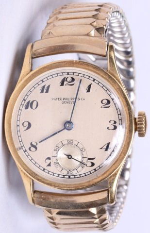 * Gentleman's Patek Philippe 18k Gold Wristwatch: Yellow gold, having jeweled movement, stem wound and set with Arabic numeral markers and second subsidiary on a silver finish dial, signed "Patek Philippe and Co. Geneva" and contained in an 18K yello