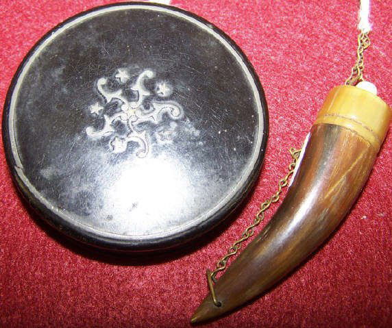 *2 PIECES: Miniature powder horn, approximate length 3" and a European black ebony pin box with inlaid top, diameter 2 3/4".
