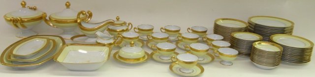 *SET OF HUTSCHENREUTHER DINNERWARE: Having gilt and light green finish, 12 dinner plates, 12 salad plates, 12 soup bowls, 12 fruit bowls, 13 bread plates, 9 saucers, 12 cups, saucer with attached under dish, creamer, sugar, covered butt