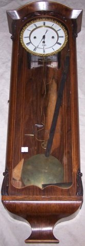 *19 C. VIENNESE WALL CLOCK: Fitted with time and quarter hour strike movement, the enamel dial having Roman numeral markers enclosed in Biedermeier style rosewood case, approximate height 35 1/2".