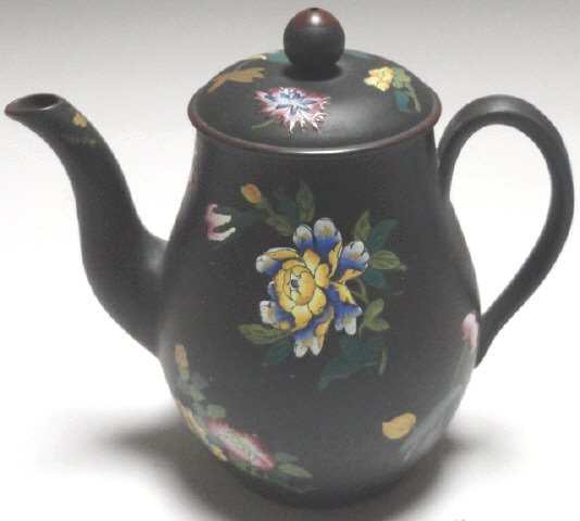 WEDGWOOD JASPERWARE TEAPOT: Circa 1875, having enameled floral decoration, approximate height 5 1/2".