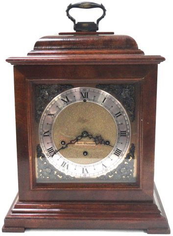 *SETH THOMAS BRACKET CLOCK: Fitted with time and quarter hour strike movement, the silvered metal dial having Roman numeral markers, enclosed in mahogany case.