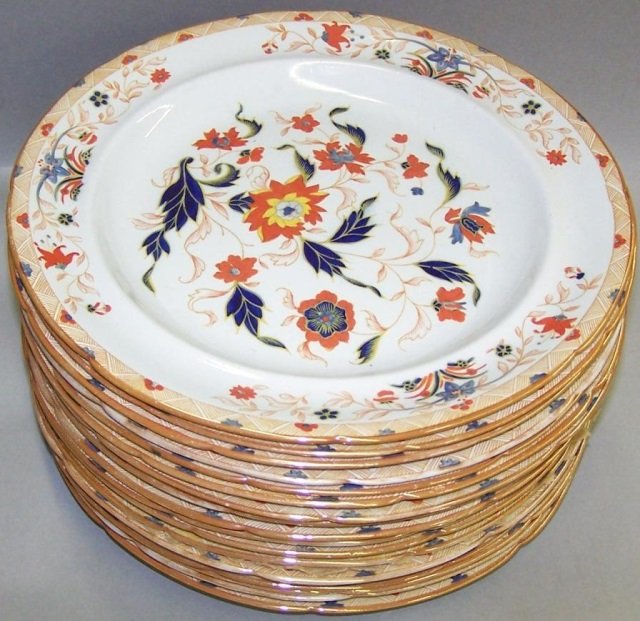 18 WEDGWOOD'S STONE CHINA DINNER PLATES: Circa 1840, with floral decoration and underside having blue Wedgwood's mark, approximate diameter 9 1/2". CONDITION: Some rim gilt loss. Estimate $ 100-200