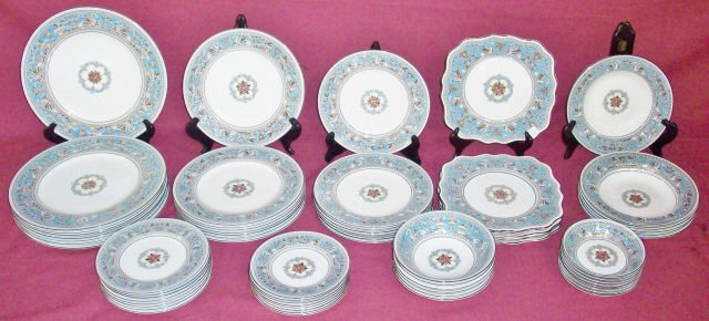 *SET OF WEDGWOOD DINNERWARE: "Florentine" pattern, 8 dinner plates, 8 luncheon plates, 6 salad plates, 7 hors d'oeuvres plates, 8 bread plates, 8 cake plates, 6 cream soup bowls, 6 bowls, 8 teacups and saucers, 6 coffee cups and 