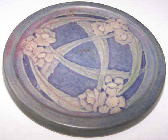 *NEWCOMB COLLEGE ART POTTERY TRIVET: Having floral decoration, marked underside with impressed CN, approximate diameter 5 1/2".