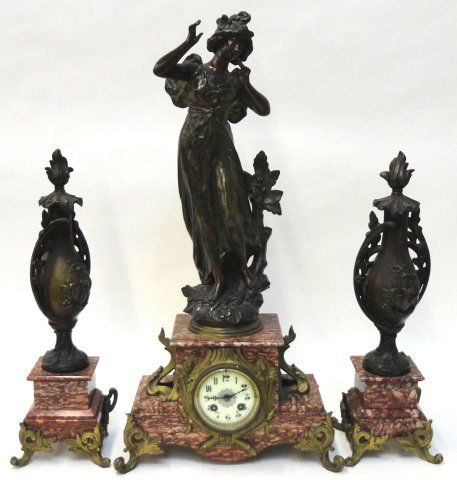 3 PIECE CLOCK GARNITURE SET: Figural clock fitted with time and strike movement, porcelain dial having Arabic numeral markers, enclosed in marble and gilt metal case surmounted with Victorian beauty, together with pair of matchin