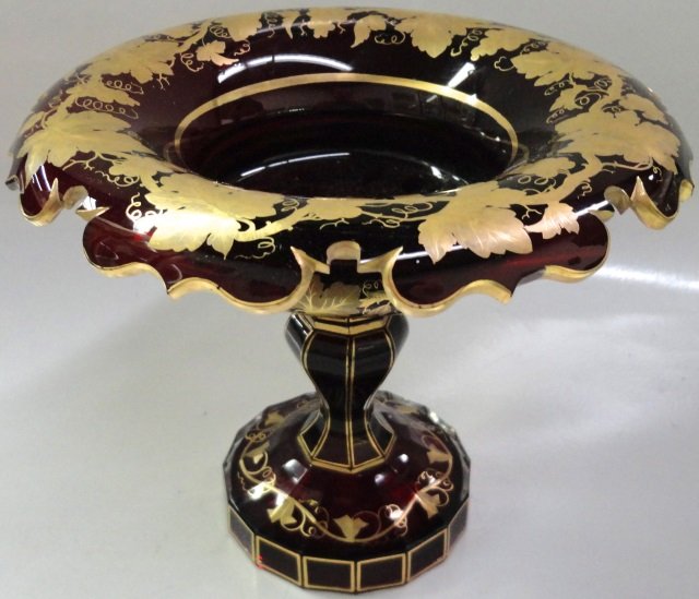 BOHEMIAN ART GLASS COMPOTE: Circa 1880, having ruby glass with gilt leaf design, approximate height 6 1/2".