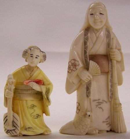 *2 CARVED IVORY NETSUKES: Figure holding fan and broom and a seated woman with musical instrument and fan, both signed on underside. Note: Items containing ivory will only be shipped domestically and cannot be shipped to Calif