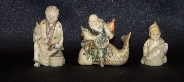 3 PIECES OF CARVED IVORY: Depicting men with fish and Netsuke of elder seated on fish, approximate height 2", 1 3/8" and 1 3/4". Note: Items containing ivory will only be shipped domestically and cannot be shipped to Californi