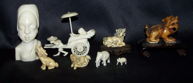 GROUP OF CARVED IVORY: Rickshaw, elephant figures, Foo dogs, etc. Note: Items containing ivory will only be shipped domestically and cannot be shipped to California.