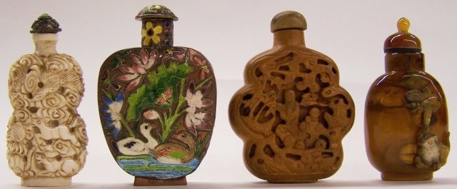 *4 SNUFF BOTTLES: Carved ivory, porcelain, champleve and carved wood. Note: Items containing ivory will only be shipped domestically and cannot be shipped to California.