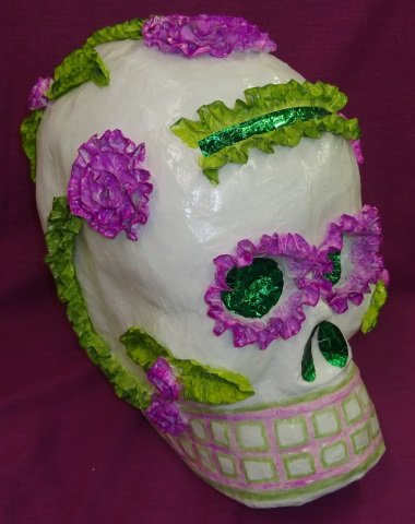 *LINARES, PAULA G.: Paper mache skull, enclosed in plexiglass case, signed on underside Mexico D. F. 2002, approximate height of skull 17".