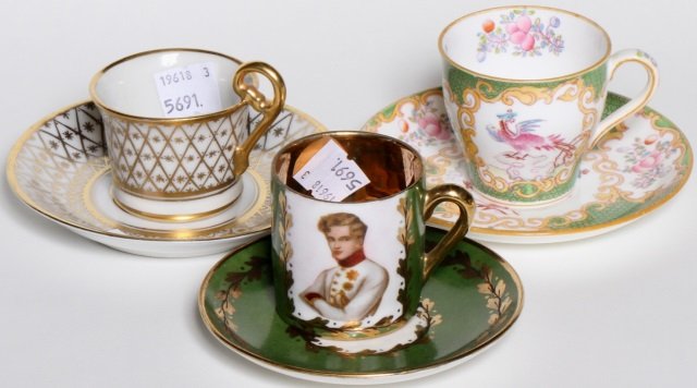 *3 DEMITASSE CUPS & SAUCERS: Sevres circa 1890 with gilt decoration, Minton 1890-1891 with floral and exotic bird decoration, and a Sevres 19th C. decorated with bee and portrait of gentleman, all marked on underside.