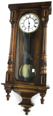 *VICTORIAN REGULATOR WALL CLOCK: Fitted with time only movement, enamel dial having Roman Numeral markers, enclosed in walnut case.