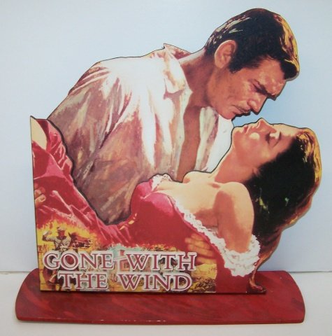 *HANDMADE STANDEE: From the MGM Motion Picture Gone With the Wind with Clark Gable and Vivian Leigh in an embrace, standee has wood backing with 3D lettering that spells out "Gone With the Wind", approximate height 16",