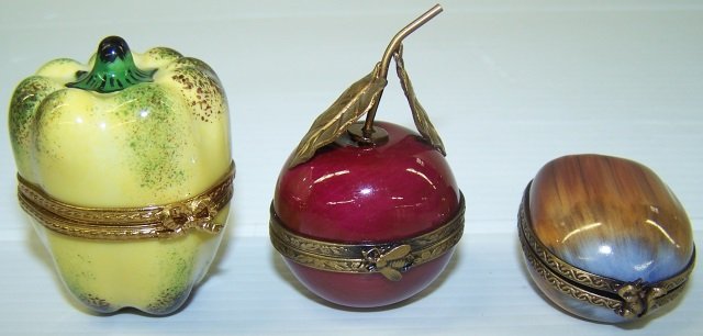 *3 LIMOGES PORCELAIN TRINKET BOXES: Pepper, approximate height 1 3/4", cherry, height 2" with stem and nut, height 1 1/2".